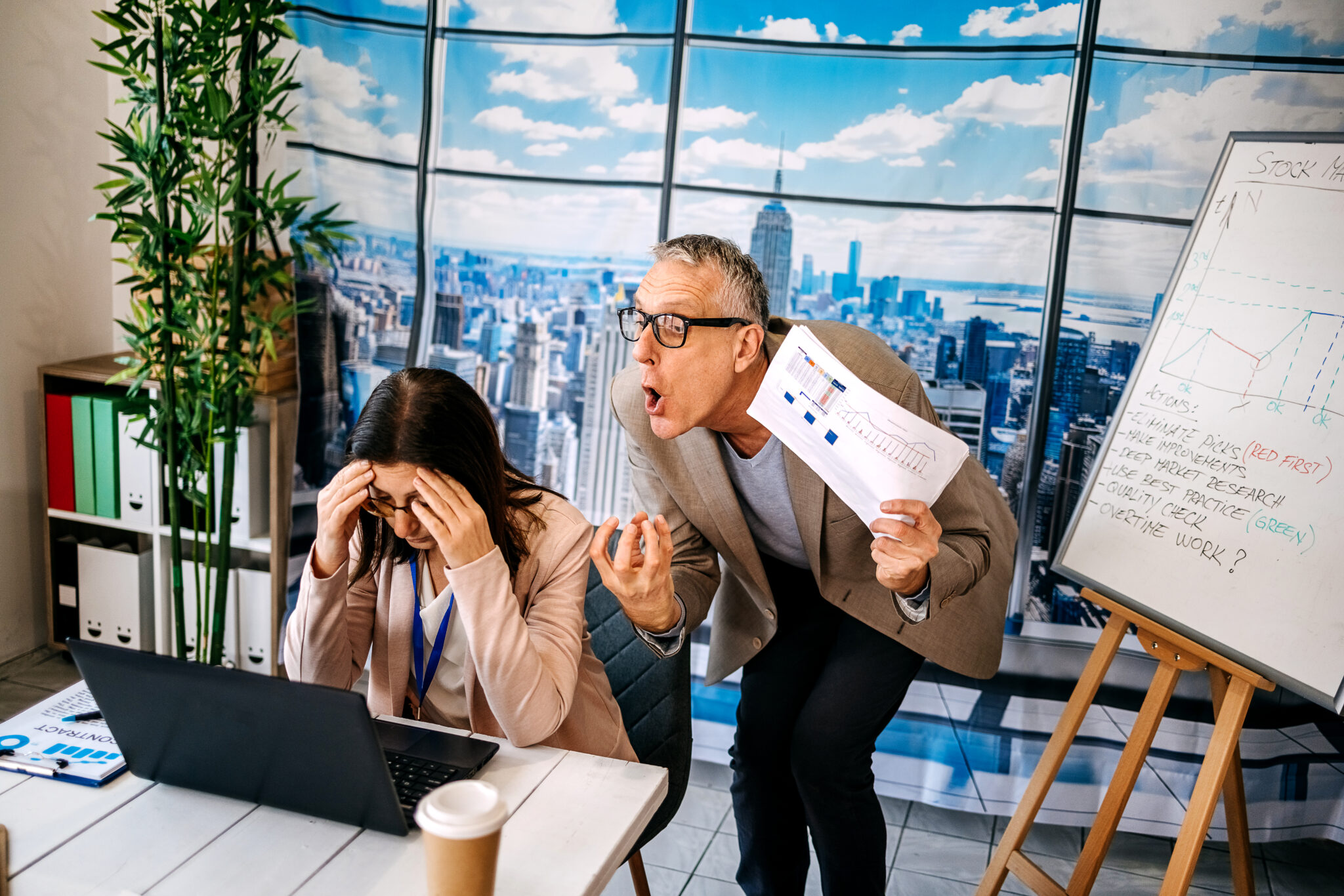 Man mobbing his colleague woman in office while working together